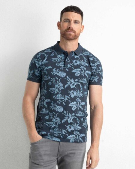 Polo Shirt All Over Print Botanical. Ανδρικό πόλο μπλουζάκι με botanical print και μονόχρωμο τελείωμα στο γιακά και τα μανίκια. Σύνθεση 100% cotton.