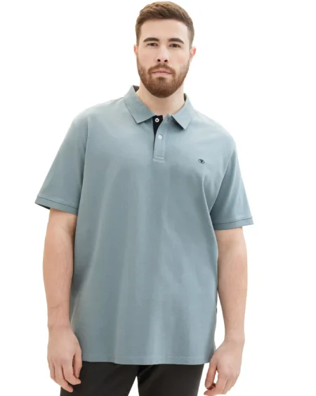 Basic Mens Polo Pique Plus Size Grey Mint with Navy contrast Ανδρικό μπλουζάκι πικέ με γιακά. Μονόχρωμο γκρι της μέντας με αντίθεση μπλε στην πατιλέτα. Regular Fit, minimal κλασικό ύφος και δροσερό βαμβακερό ύφασμα. Οδηγός μεγάλων μεγεθών Description : *a logo print on the front * short-sleeved with a polo collar and half a button tab * Regular fit * with organic cotton from sustainable cultivation * with rib on the hem edges * with rib on the collar and sleeve hem. Material 100% cotton.